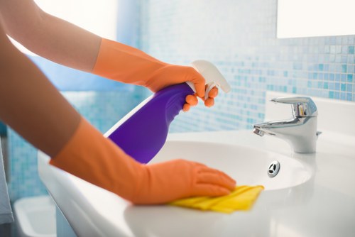 Professional cleaner preparing a regular cleaning visit in Camden