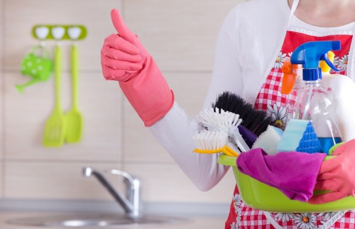 Local cleaner working in a Camden apartment kitchen