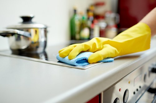 Cleaning staff following safe chemical handling procedures